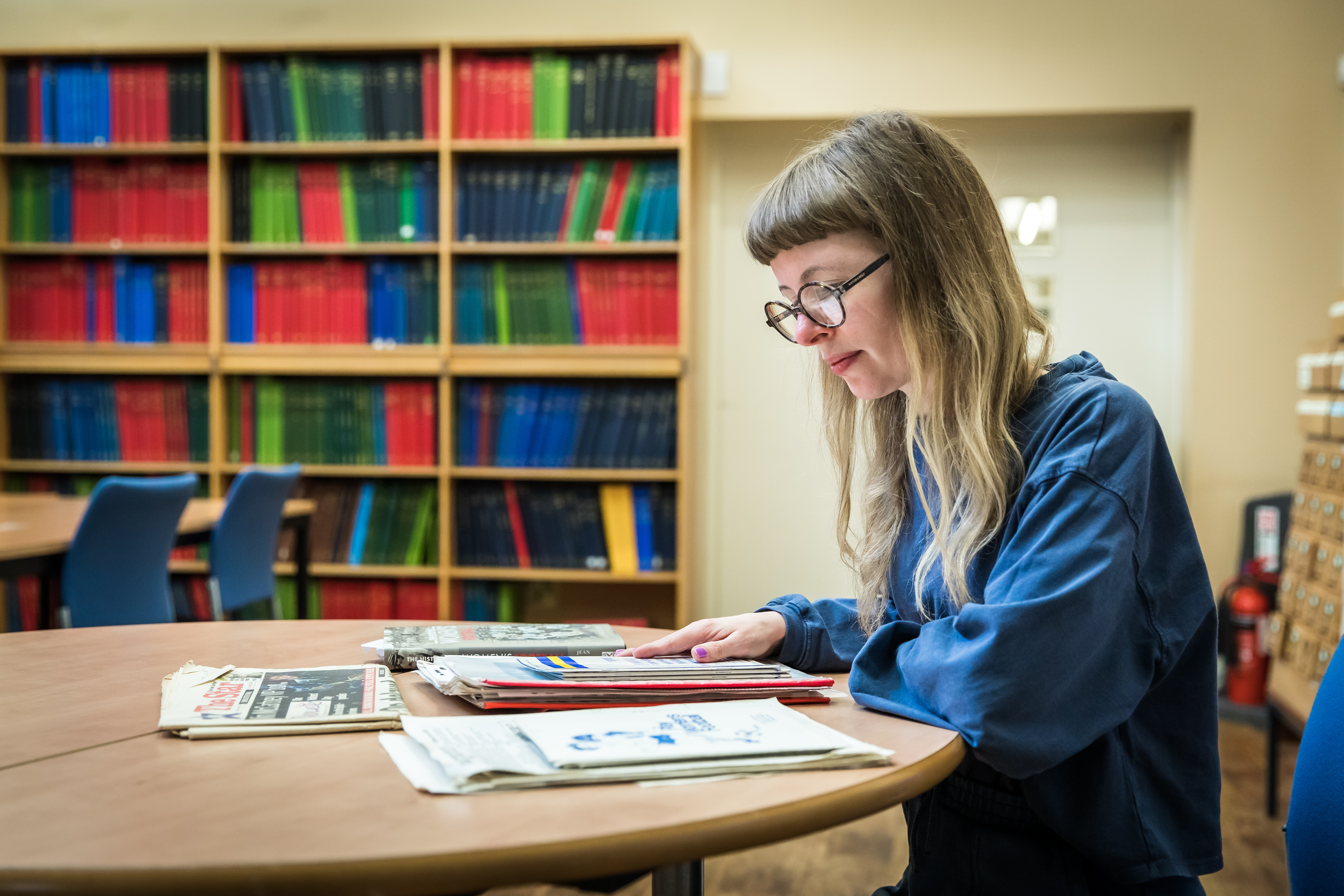 Female reading local archives