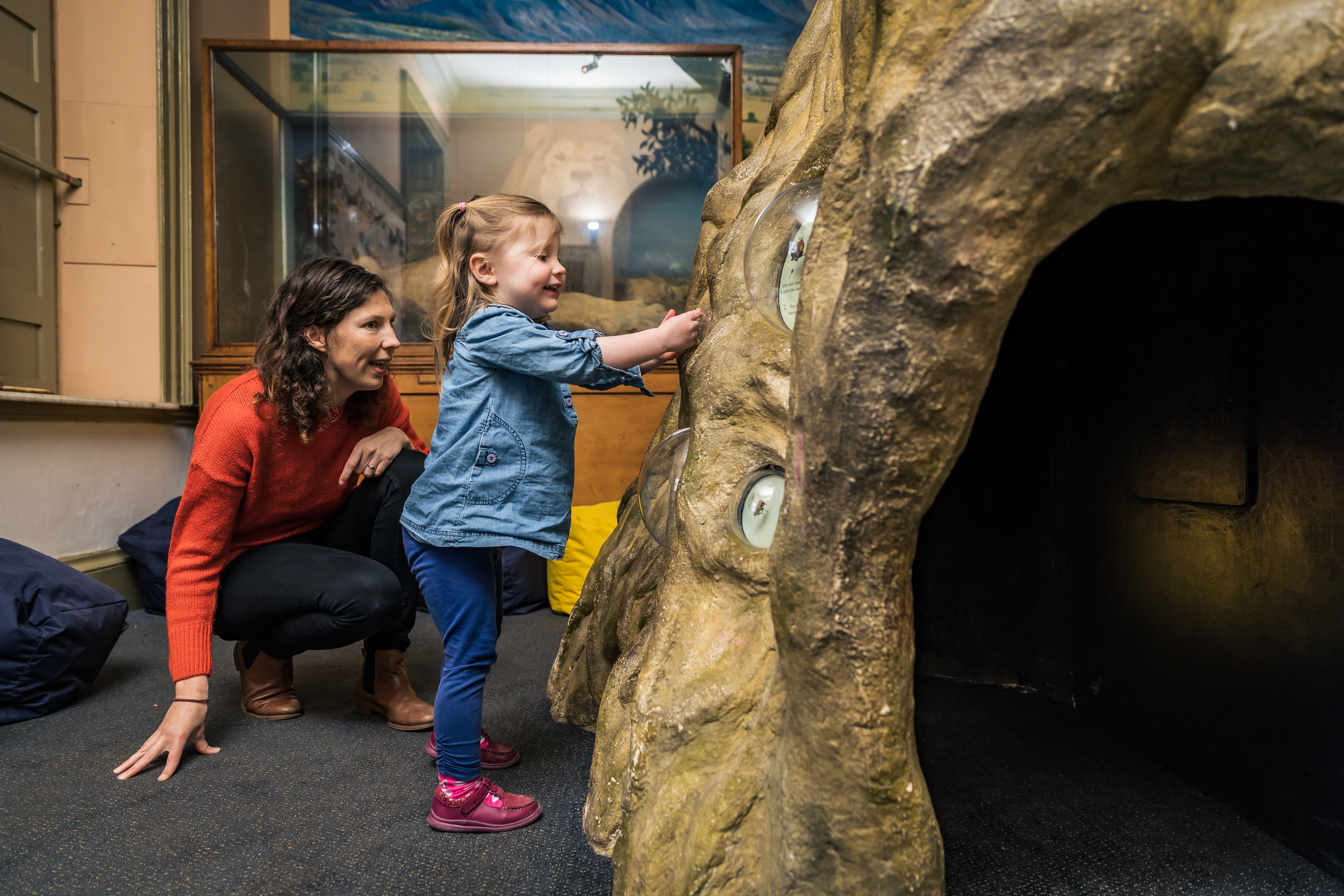 Woman and child inside the lions den exhibition