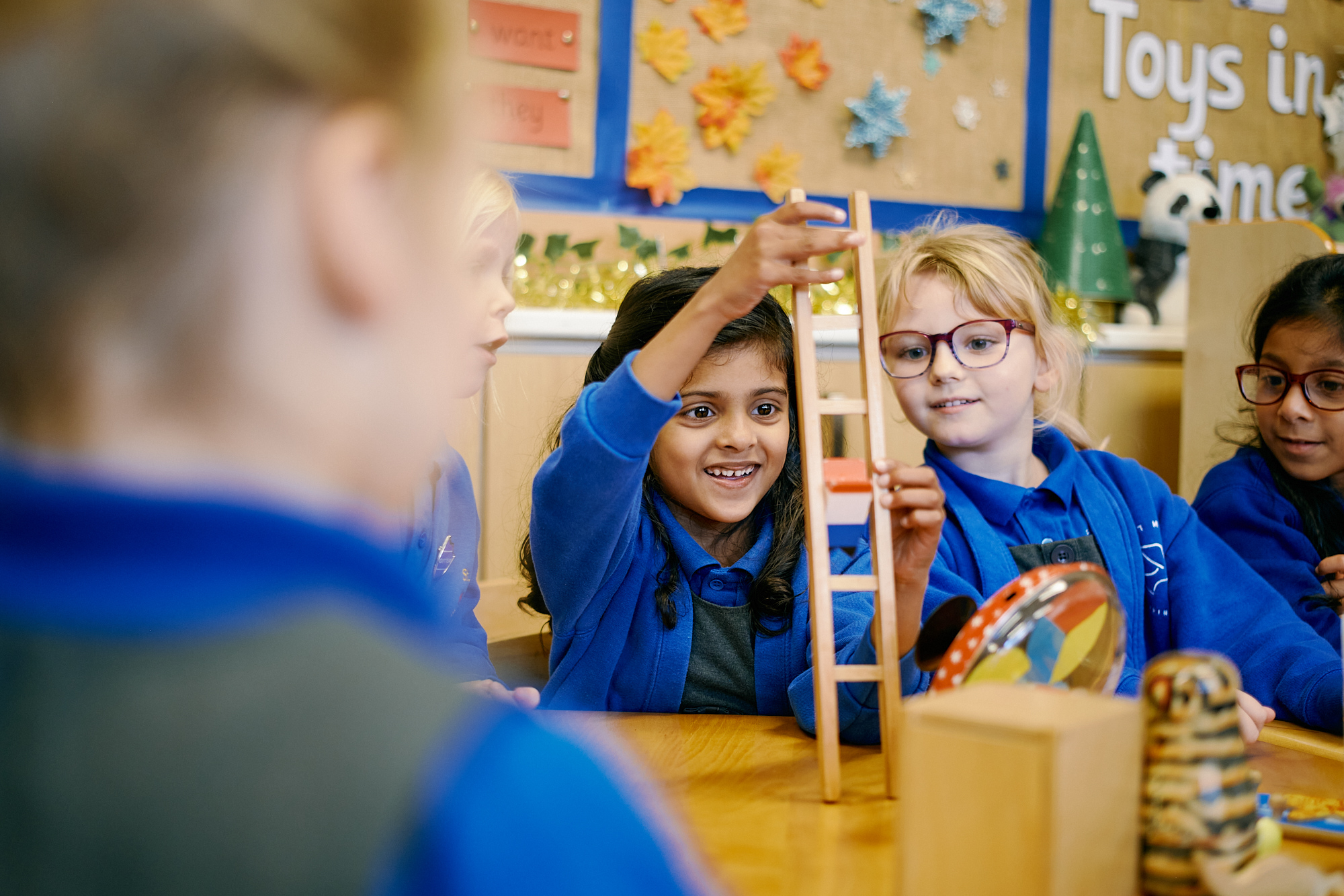 Children playing with wooden toys